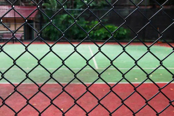 Photo of A dirty, unused tennis court