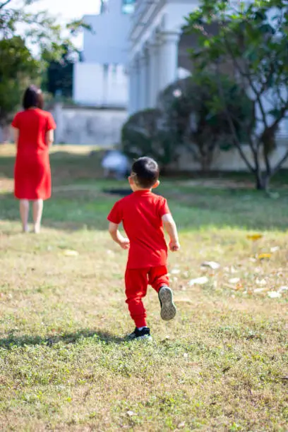 Chinese New Year Boy catching his mom