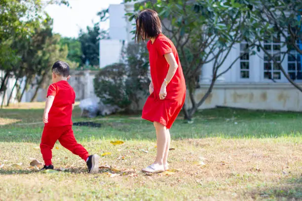 Chinese New Year Boy and mom walking in the field