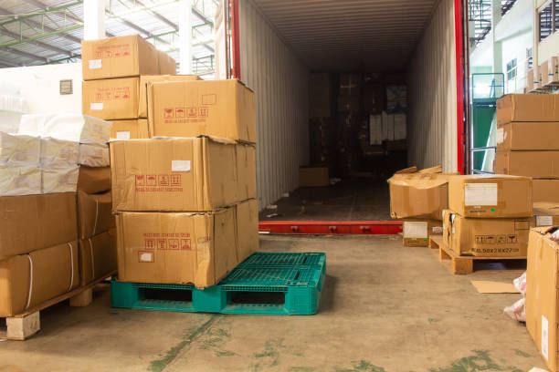 istock The cartons with loading out of container 1300435776