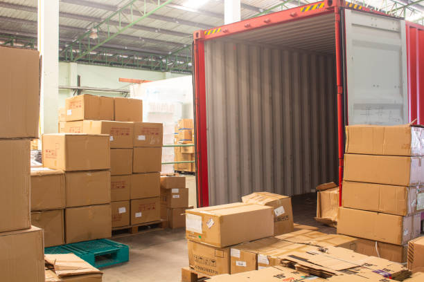 istock The cartons with loading out of container 1300435778