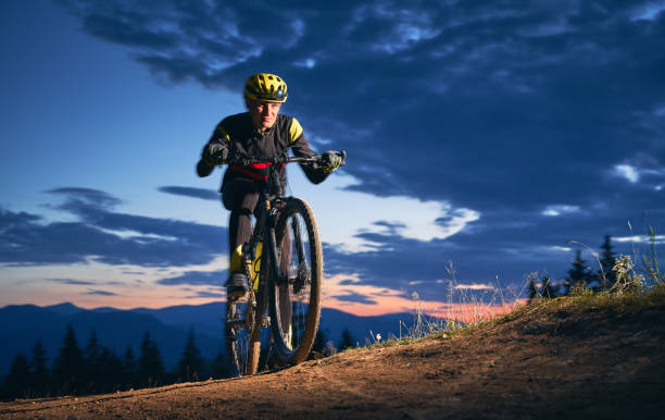 istock Young man riding a mountain bike downhill style 1300436037