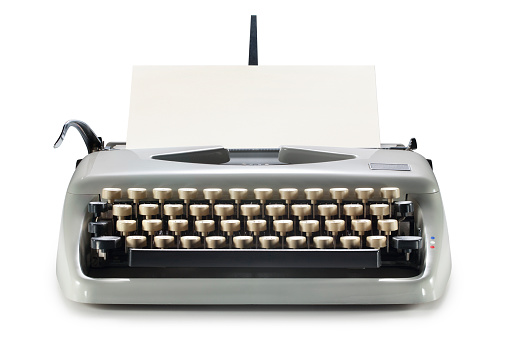 Vintage typewriter isolated on white background.