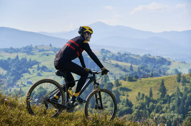 istock Young man riding a mountain bike downhill style 1300438718