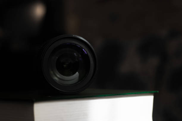 istock Lens in the dark close up, front view 1300440937