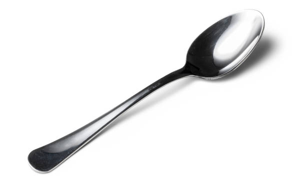 istock Cutlery dessert spoon isolated on white background 1300442054