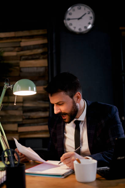 istock Young businessman working on laptop at office. 1300443174
