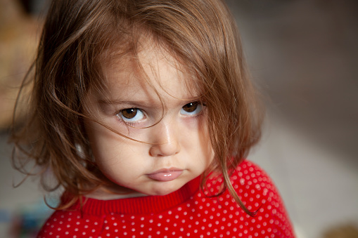Portrait of 2.5 years old baby girl angry