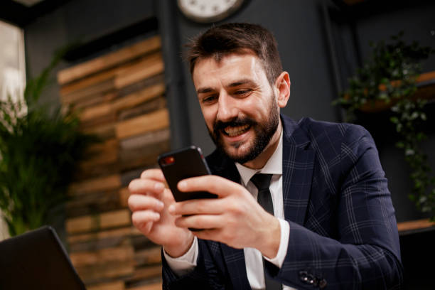 istock Young businessman using the phone in the office 1300444206