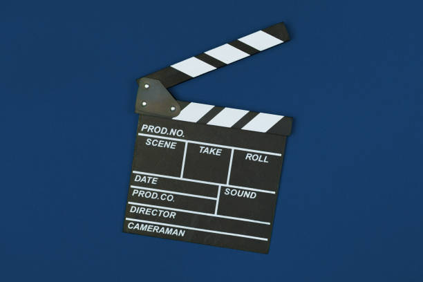 istock Film clapper board on classic blue background top view 1300444261