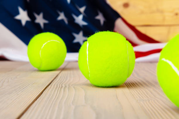istock Tennis equipment on wooden surface close up 1300444384