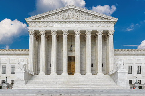 The front of the United States Supreme Court Building in Washington DC, USA.