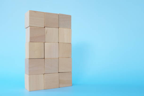istock Building blocks tower in blue background with copy space. Stability, achievement and growth concept 1300445123