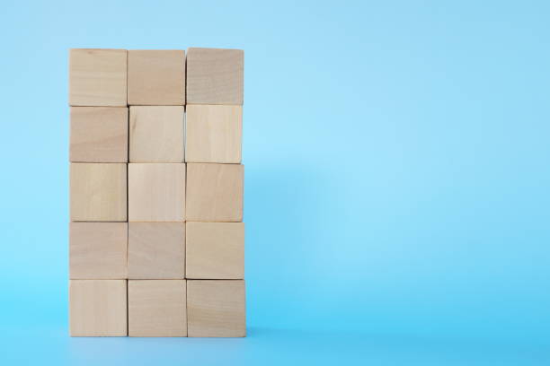 istock Building blocks tower in blue background with copy space. Stability, achievement and growth concept 1300445132