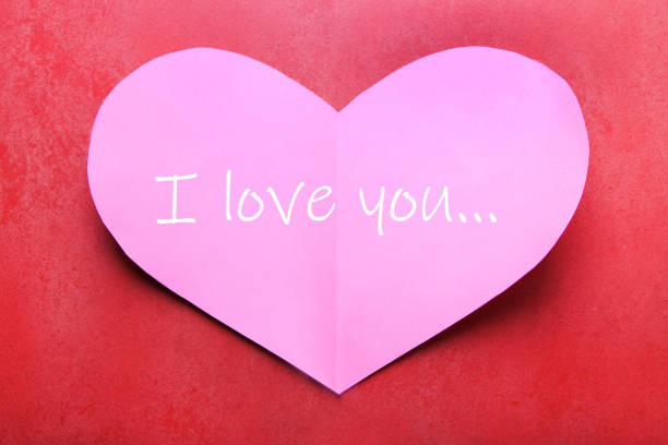 istock Love note on paper pink heart 1300446264
