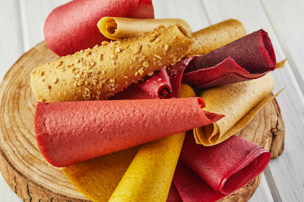 istock Sweet pure fruit pastille in rolls. Healthy sweets - lozenges, fruit chips. Natural sweets from berries and fruits. Diet vitamin food and vegan food 1300447230