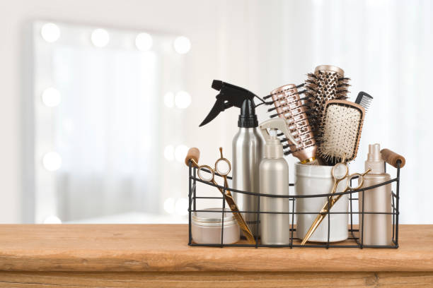 Hairdresser tools on wooden table with blurred beauty salon background Hairdresser tools on wooden table with blurred beauty salon background hairdresser stock pictures, royalty-free photos & images