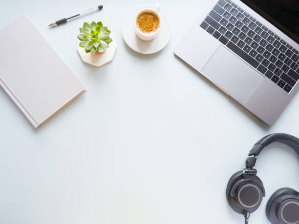 istock flat lay composition with laptop, pen, coffee, notebook, headphones on grey background. Concept remote study and work at home, telework, freelance, quarantine. Distance online learning. Copyspace. 1300448393