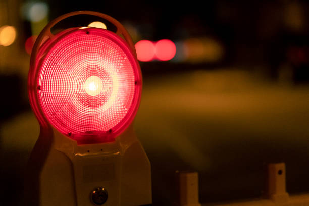 istock Closeup of a red warning lamp at night. 1300449322