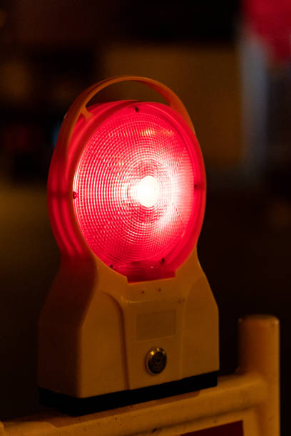 istock Closeup of a red warning lamp at night. 1300449327
