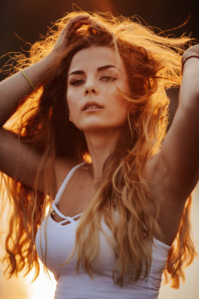 istock Sensual young woman at sunset 1300453714