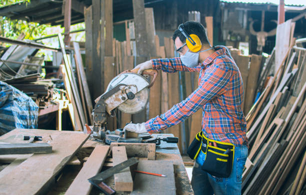 istock A carpenter is working in a woodworking office.caucasion white male carpenter using electric circular saw cut wood 1300454530