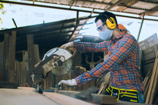 istock A carpenter is working in a woodworking office.caucasion white male carpenter using electric circular saw cut wood 1300454531