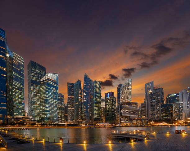 istock Singapore financial downtown lights at dusk 1300460465