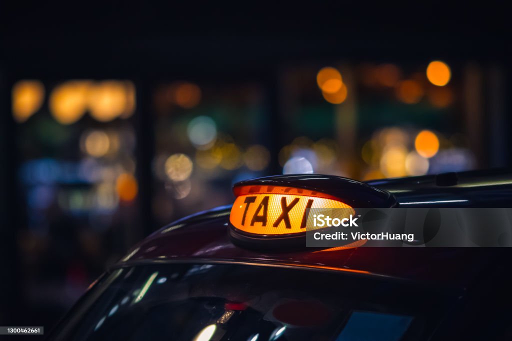 London black cab taxi sign London black cab taxi sign at night Taxi Driver Stock Photo