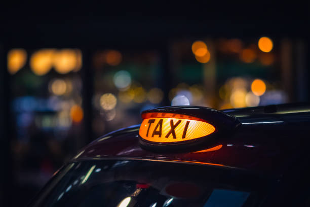 London black cab taxi sign London black cab taxi sign at night taxi driver photos stock pictures, royalty-free photos & images