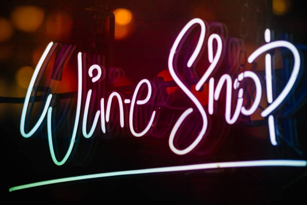 istock Glowing wine shop neon sign 1300462730