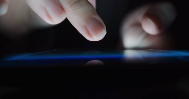 istock Human hands are moving on the smartphone screen while using phone. Extreme close-up 1300462864