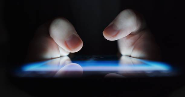 istock Human hands are moving on the smartphone screen while using phone. Extreme close-up 1300462874