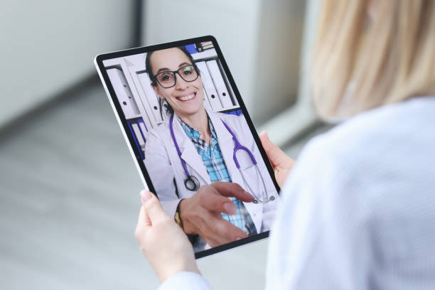 istock Patient consults with doctor via video call on tablet 1300462926
