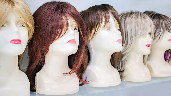 wig shop, row of mannequins in a peruke shop