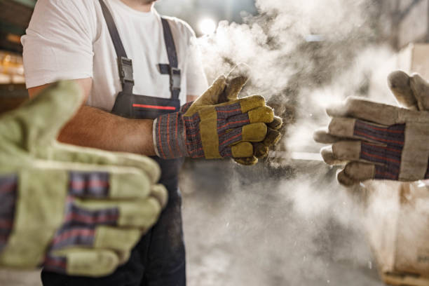 istock Cleaning dirt from gloves in a warehouse! 1300466205