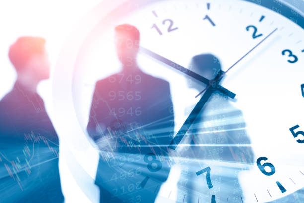 istock Business times or working hours concept blur office people talking overlay with time clock 1300466920