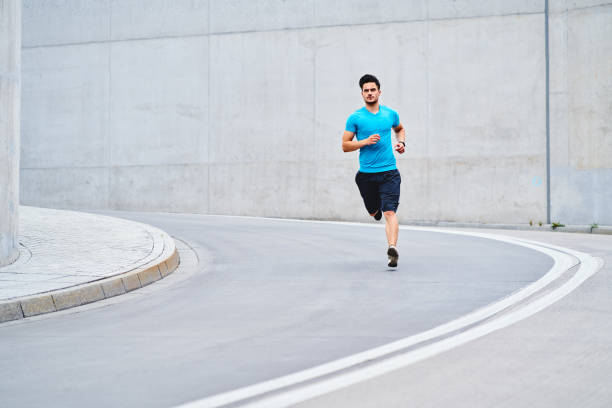 istock Athletic man running on the street 1300467178