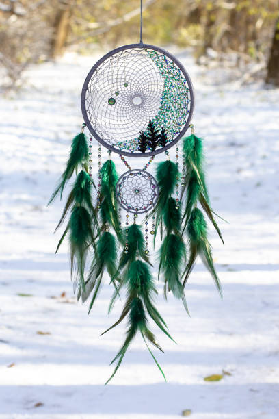 istock Handmade dream catcher with feathers threads and beads rope hanging 1300468883