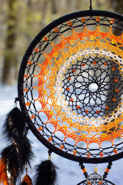 istock Handmade dream catcher with feathers threads and beads rope hanging 1300468885