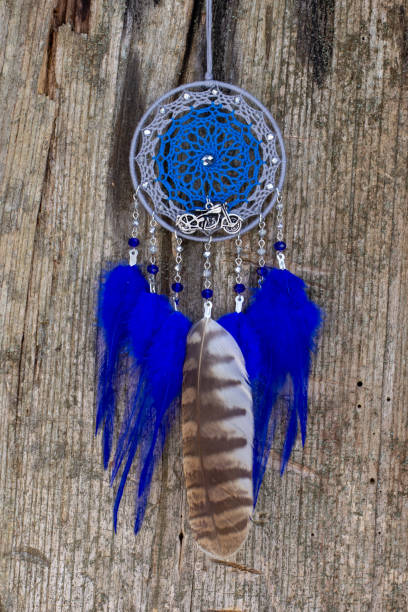 istock Handmade dream catcher with feathers threads and beads rope hanging 1300468901