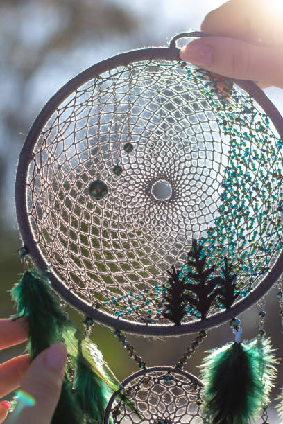 istock Handmade dream catcher with feathers threads and beads rope hanging 1300468931