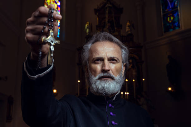 Priest Portrait of a priest in church exorcism stock pictures, royalty-free photos & images