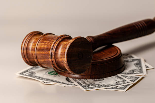 istock Law mallet and a stack of money 1300470156