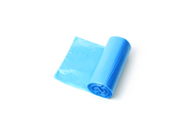 istock Roll of blue garbage bags isolated on white 1300471186