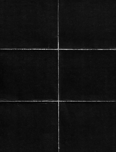 istock Old Black Empty Ripped Folded Torn Cardboard Paper Poster. Grunge Scratched Old Shabby Surface. Distressed Overlay Texture for Collage. 1300471902