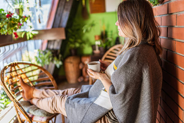 istock Woman enjoying on a terrace 1300472038