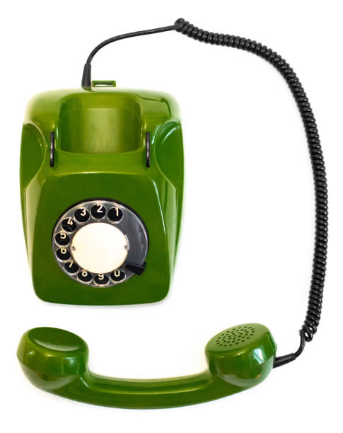 istock Old green rotary telephone on a white background 1300473230