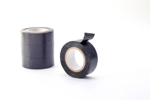 istock Rolls of black insulating tape isolated on a white background. 1300474150