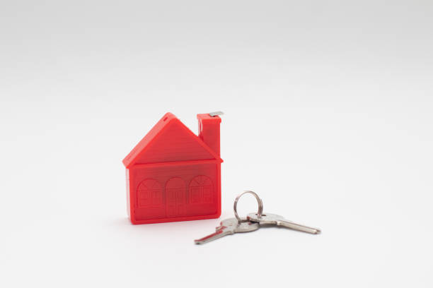 istock Red House model with keys. Real estate. 1300474249